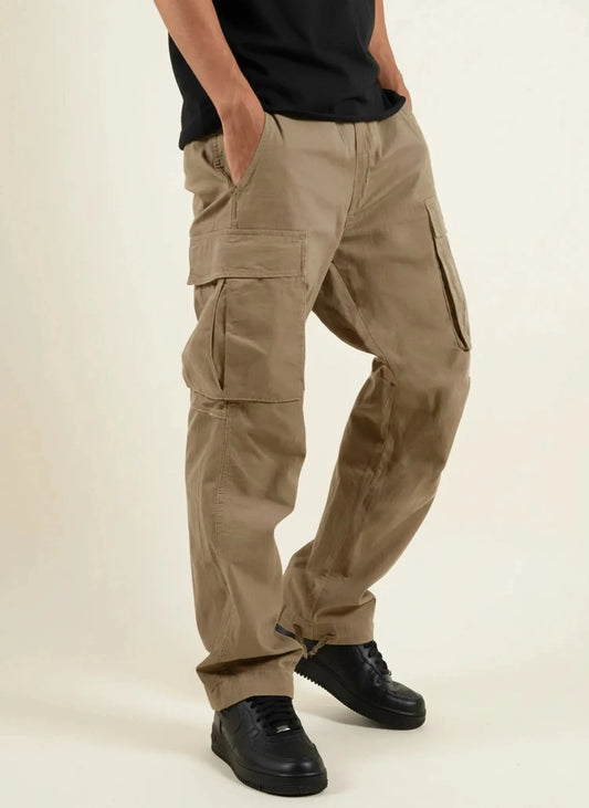 View of relaxed fit cargo pants in khaki, featuring multiple pockets and a comfortable waistband