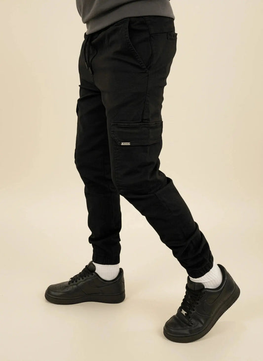 View of modern slim tapered cargo pants in olive green, featuring multiple pockets and a comfortable fit