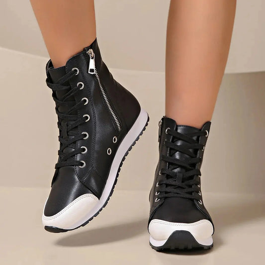 View of women's chic supportive sneakers in light gray mesh material with cushioned sole and stylish design