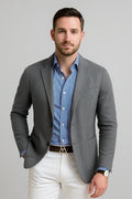 View of a polished relaxed blazer in dark gray, featuring a smooth fabric texture and tailored lapels