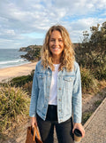 Light blue relaxed denim jacket with a button closure and two chest pockets, view