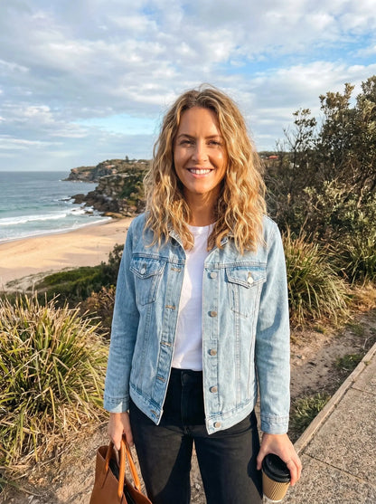 Light blue relaxed denim jacket with a button closure and two chest pockets, view