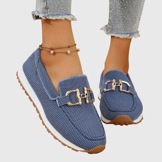 View of chic women's slip on loafers in soft taupe leather with a sleek silhouette and subtle stitching details
