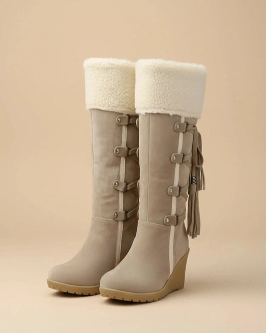 View of elegant women's winter boots in soft gray suede, featuring cozy faux fur lining and sturdy rubber soles