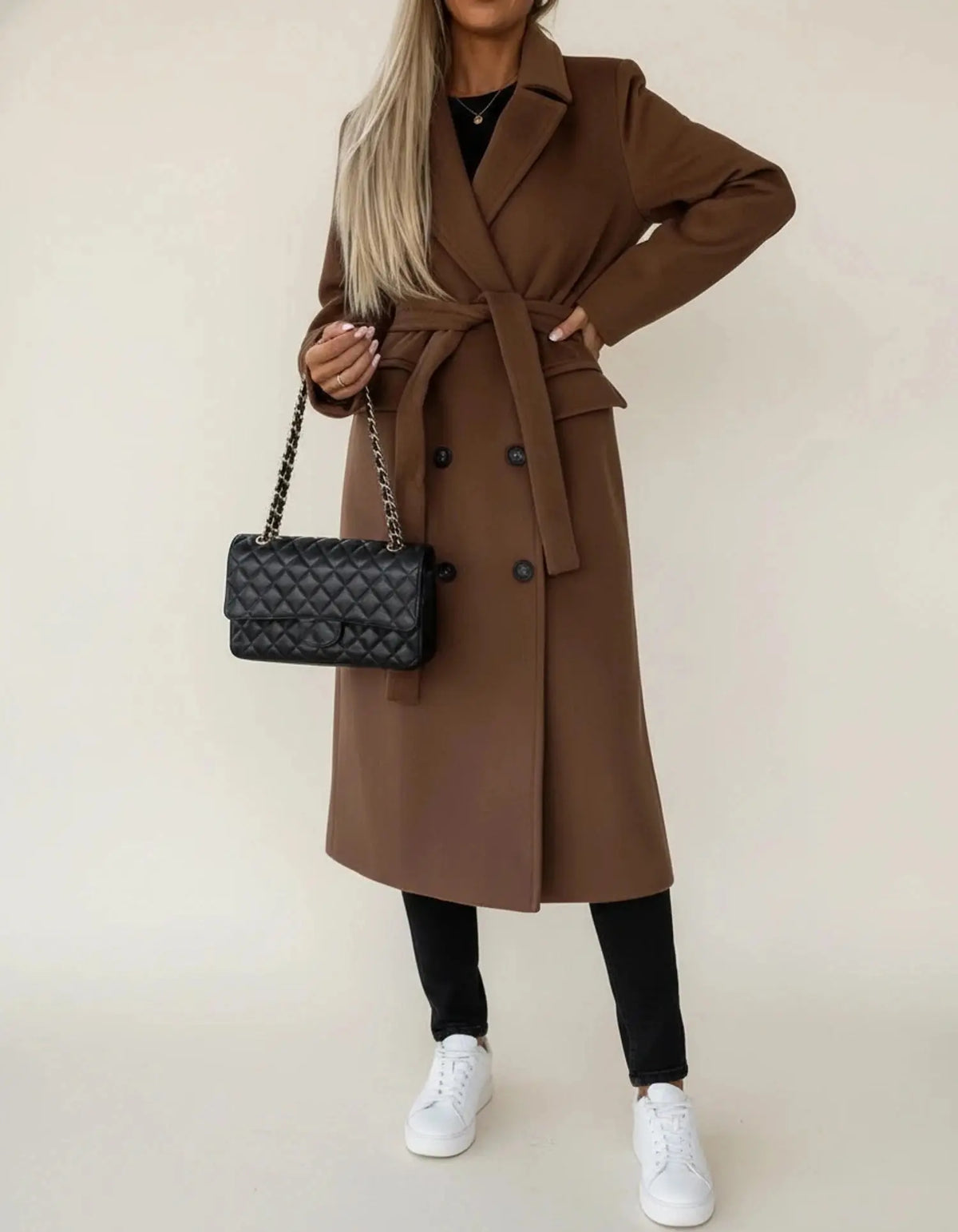 View of a sophisticated women's winter overcoat in deep burgundy, featuring a tailored fit and elegant lapels