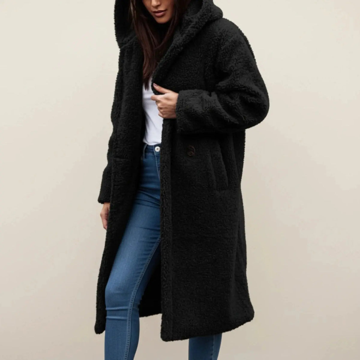 View of a cozy relaxed winter coat in soft gray fabric, featuring a hood and a slightly oversized fit
