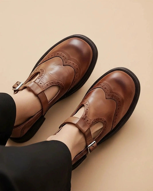 View of stylish women's Mary Jane shoes in soft black fabric, featuring a supportive strap and cushioned sole