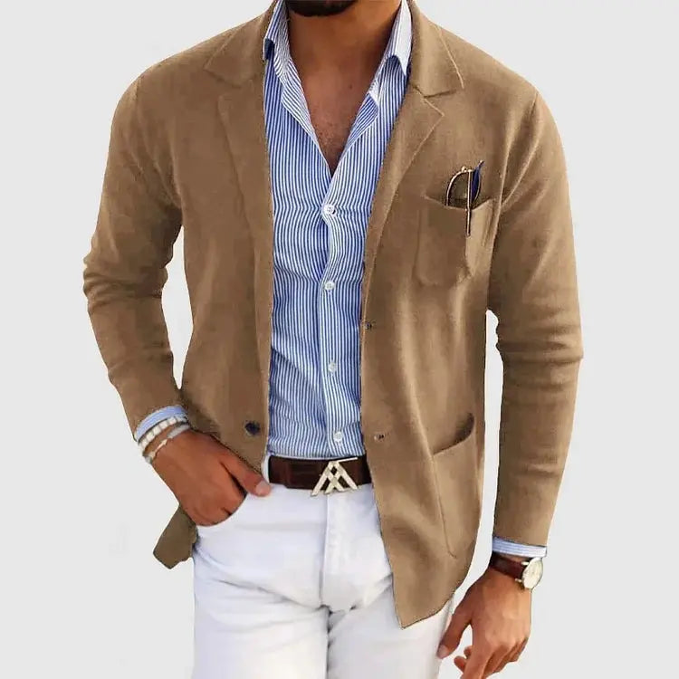View of a polished relaxed blazer in a deep charcoal gray, featuring a single button closure and notch lapels