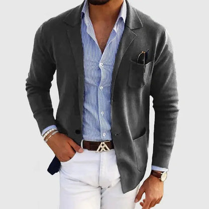 View of a polished relaxed blazer in dark gray, featuring notched lapels and a single button closure