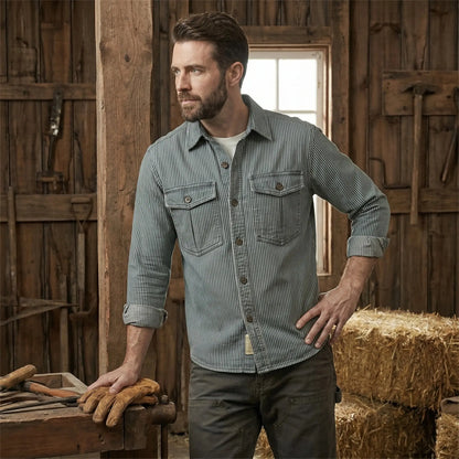 Close up view of the Mens Timeless Striped Denim Shirt showing the intricate stitching and textured fabric, showing its quality and casual elegance.