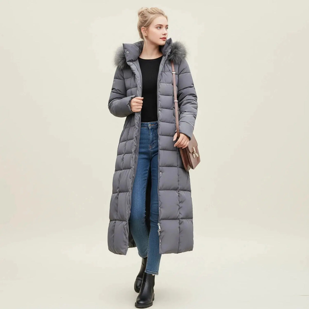 View of a chic women's quilted winter jacket in deep burgundy, featuring a high collar and stylish stitching details