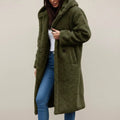 View of a cozy relaxed winter coat in soft beige fabric, featuring a hood and button closure