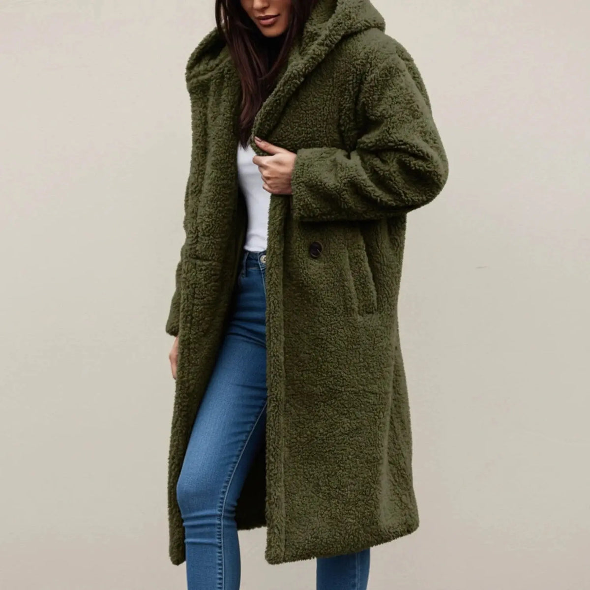 View of a cozy relaxed winter coat in soft beige fabric, featuring a hood and button closure