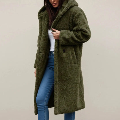 View of a cozy relaxed winter coat in soft beige fabric, featuring a hood and button closure