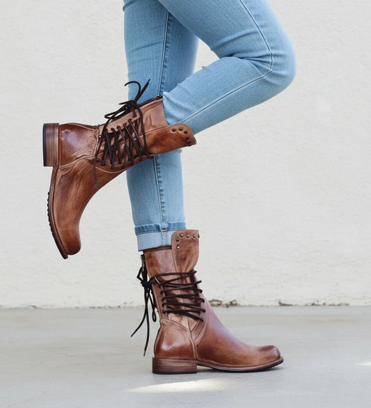 View of classic modern orthopedic boots in dark brown leather, featuring a sturdy sole and cushioned ankle support