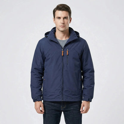 View of a navy blue water repellent outdoor jacket featuring a hood and adjustable drawstrings