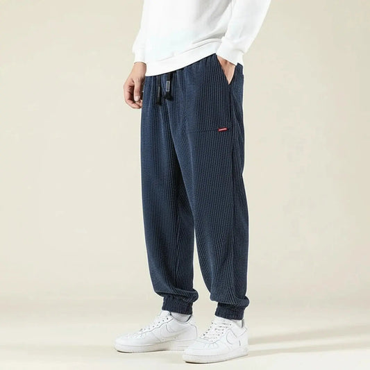 View of relaxed fit jogger pants in dark gray, made