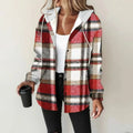 View of a relaxed fit plaid winter jacket in shades of red and black, featuring a button up closure and two pockets