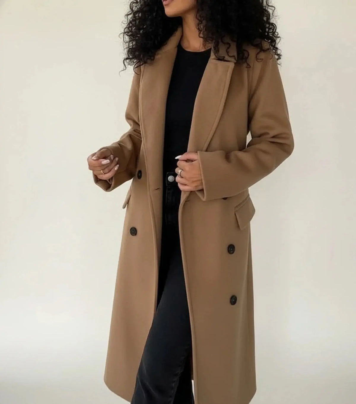 View of a sophisticated women's winter overcoat in deep burgundy, featuring a tailored silhouette and elegant lapels