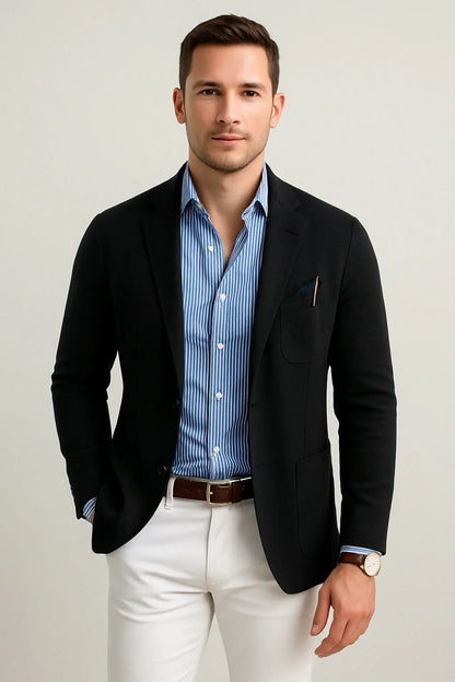 View of a polished relaxed blazer in deep charcoal gray, featuring a smooth fabric texture and subtle lapel design
