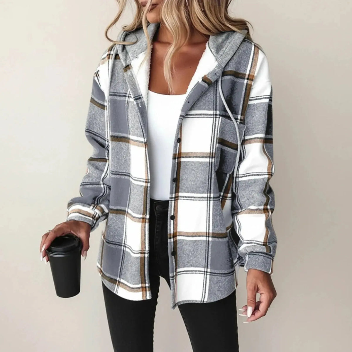 View of a relaxed plaid winter jacket in shades of red and black, featuring a cozy collar and button closure