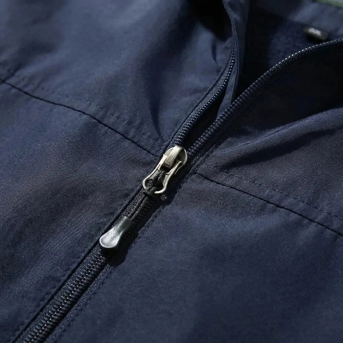 View of a sleek autumn jacket in deep green, featuring a smooth finish, zippered pockets, and a tailored fit