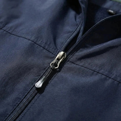 View of a sleek autumn jacket in deep green, featuring a smooth finish, zippered pockets, and a tailored fit