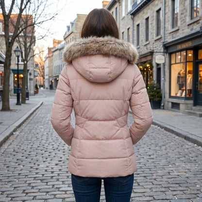 View of a fitted winter puffer jacket in deep green, featuring a high collar and quilted texture