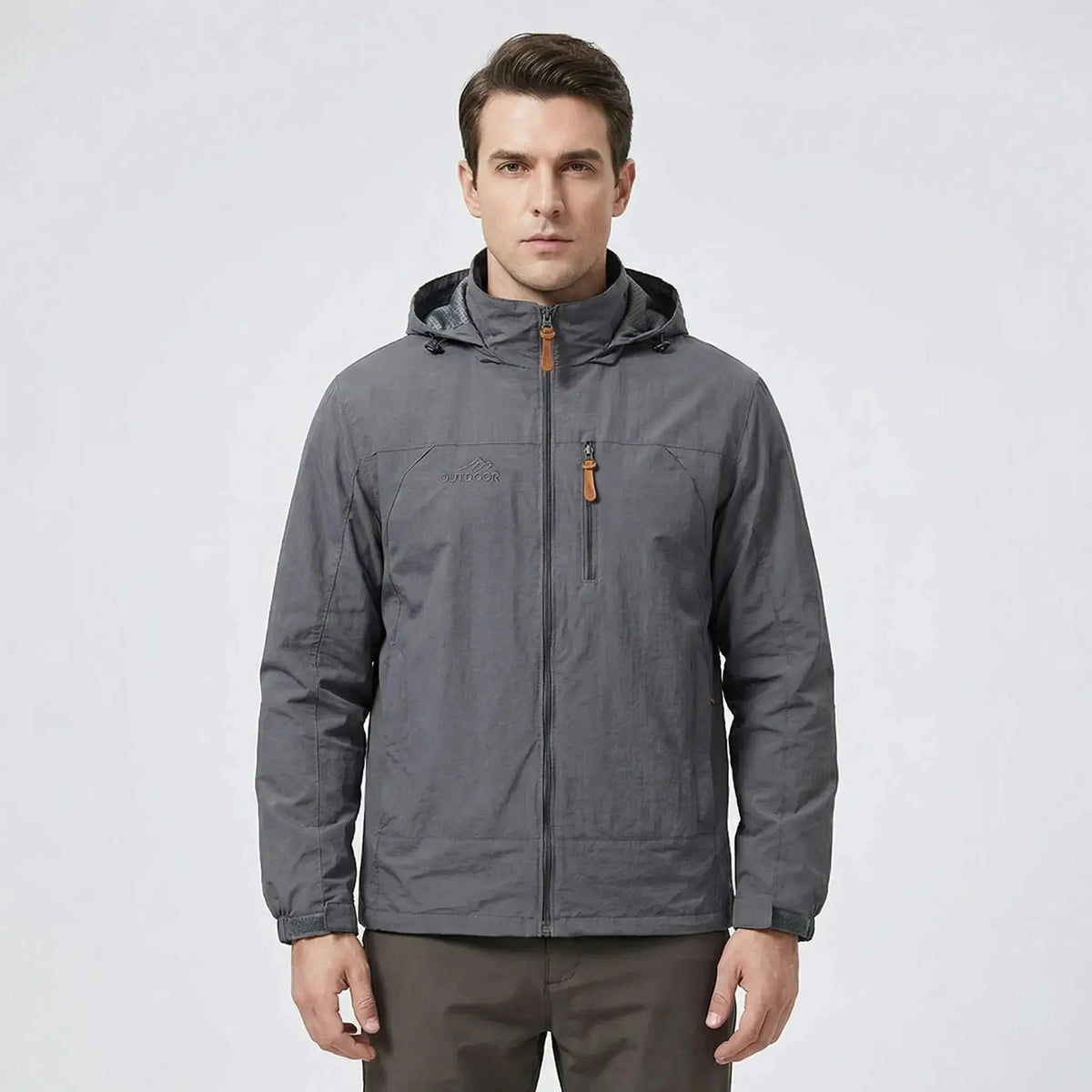 View of a men's outdoor jacket in dark green, featuring water repellent material, adjustable cuffs, and a high collar