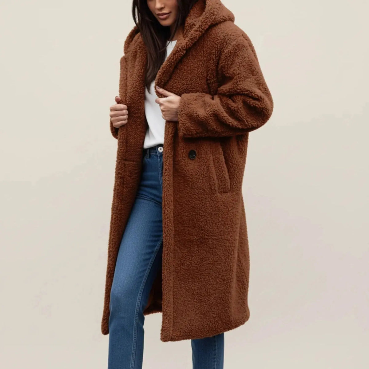 View of a cozy relaxed winter coat in soft gray fabric, featuring a large collar and button closures