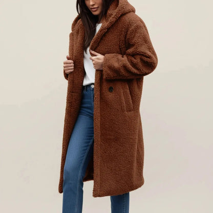 View of a cozy relaxed winter coat in soft gray fabric, featuring a large collar and button closures