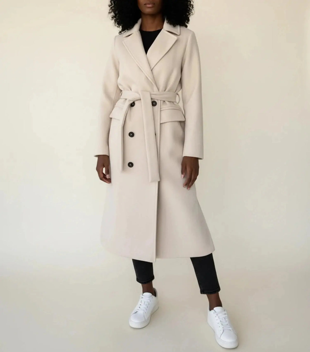 View of a sophisticated women's winter overcoat in deep burgundy, featuring a tailored fit and elegant collar