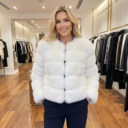 View of a luxurious fluffy autumn coat in soft beige, featuring a wide collar and elegant button closure