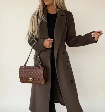 View of a sophisticated women's winter overcoat in deep burgundy, featuring a tailored fit and elegant collar