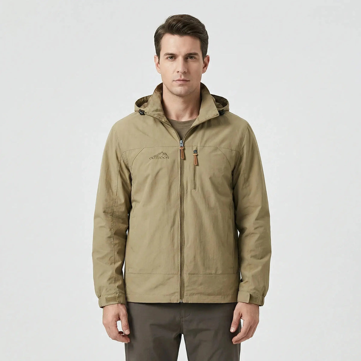 View of a water repellent outdoor jacket in dark green, featuring a high collar and zippered pockets