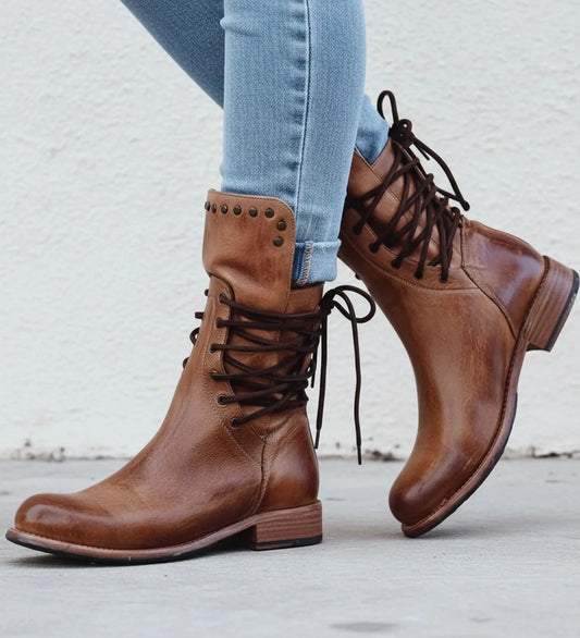 Black orthopedic boots made of leather with a modern design, featuring a round toe and sturdy sole, view
