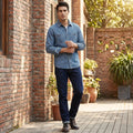A model showcases the Mens Timeless Striped Denim Shirt in a full front view, styled with complementary pieces against a neutral background.
