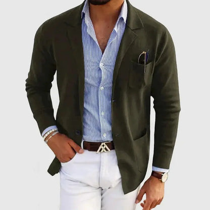View of a polished relaxed blazer in deep navy, featuring a smooth fabric, notched lapels, and subtle stitching