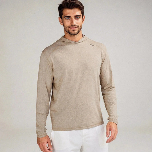 Man wearing a beige slim fit hoodie with long sleeves, standing, facing forward, and smiling