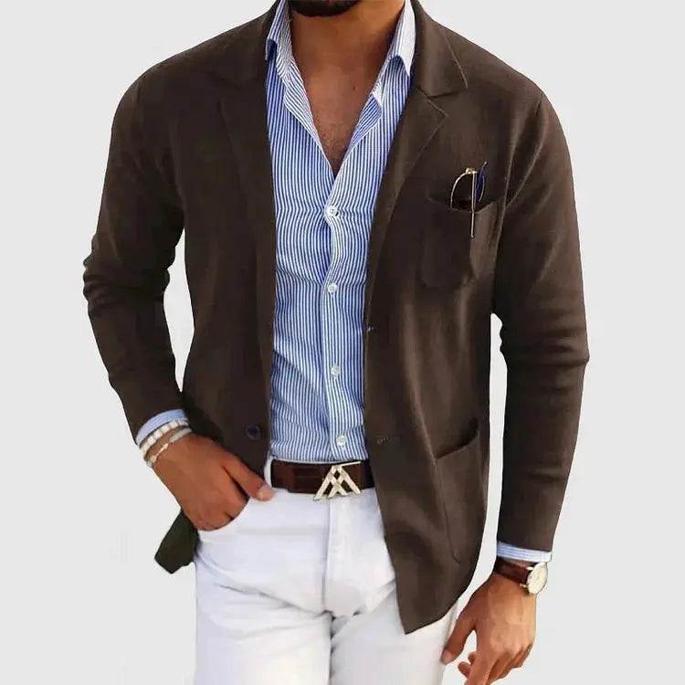 View of a polished relaxed blazer in charcoal gray, featuring a smooth fabric finish and tailored lapels