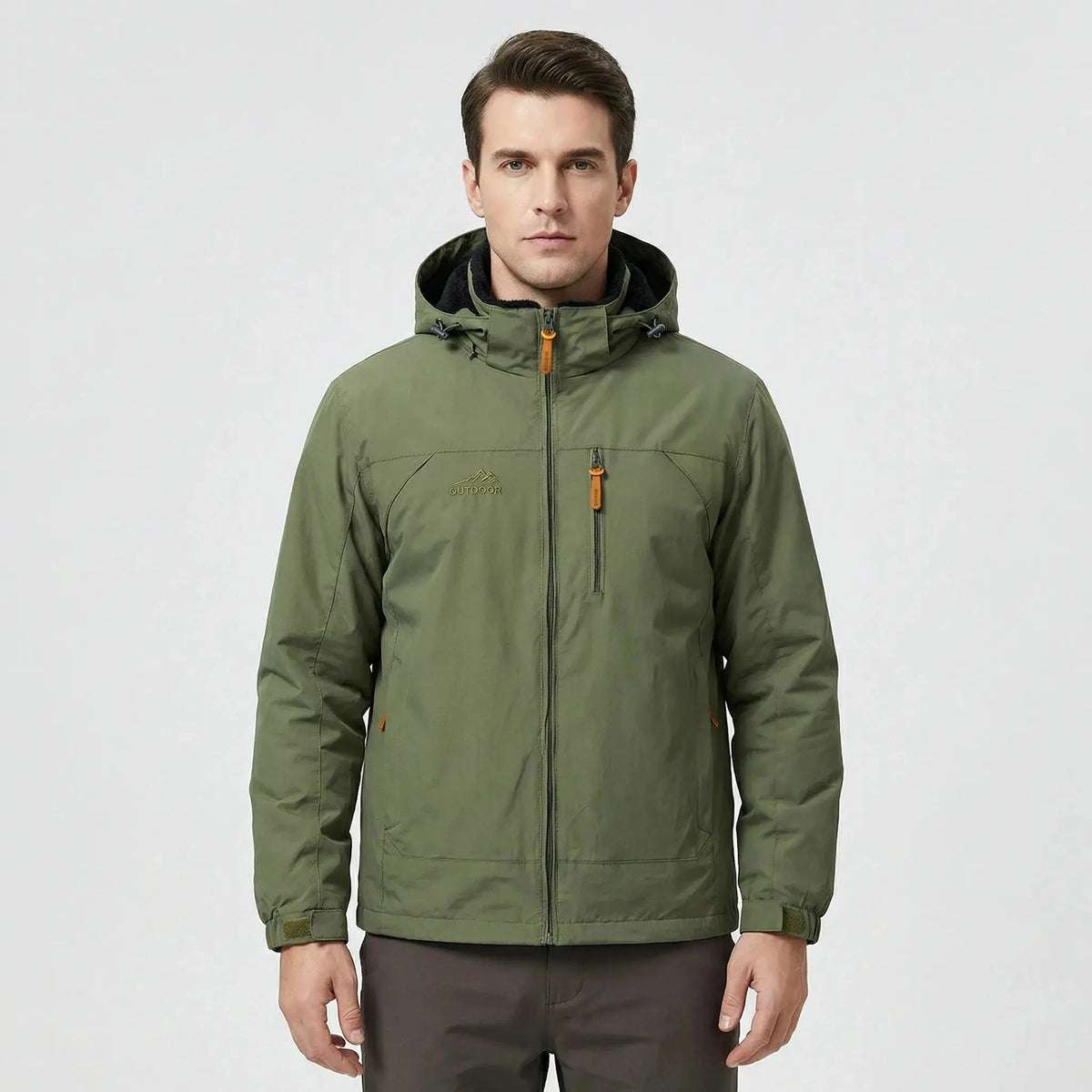 View of a men's water repellent outdoor jacket in dark green, featuring a zippered and adjustable cuffs
